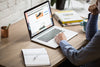 Praella Shopify Plus Agency - macbook-air-on-desk